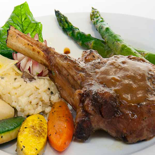 Food photography of Chicago lamb chops with rice and veggies on white plate by Food Photographer
